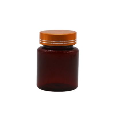 Bouteille en plastique en forme ronde en PET de 100 cc ambre/brun avec capuchon en aluminium pour capsule/pilule
