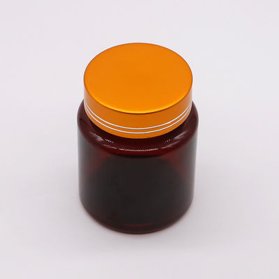 Bouteille en plastique en forme ronde en PET de 100 cc ambre/brun avec capuchon en aluminium pour capsule/pilule