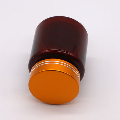 Bouteille en plastique en forme ronde en PET de 100 cc ambre/brun avec capuchon en aluminium pour capsule/pilule