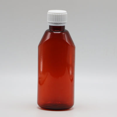 Récipient de médicaments liquides en PET de pharmacie ovale ambrée de 200 ml avec couvercle et échelle